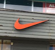 Logo de Nike Factory Store La Plata